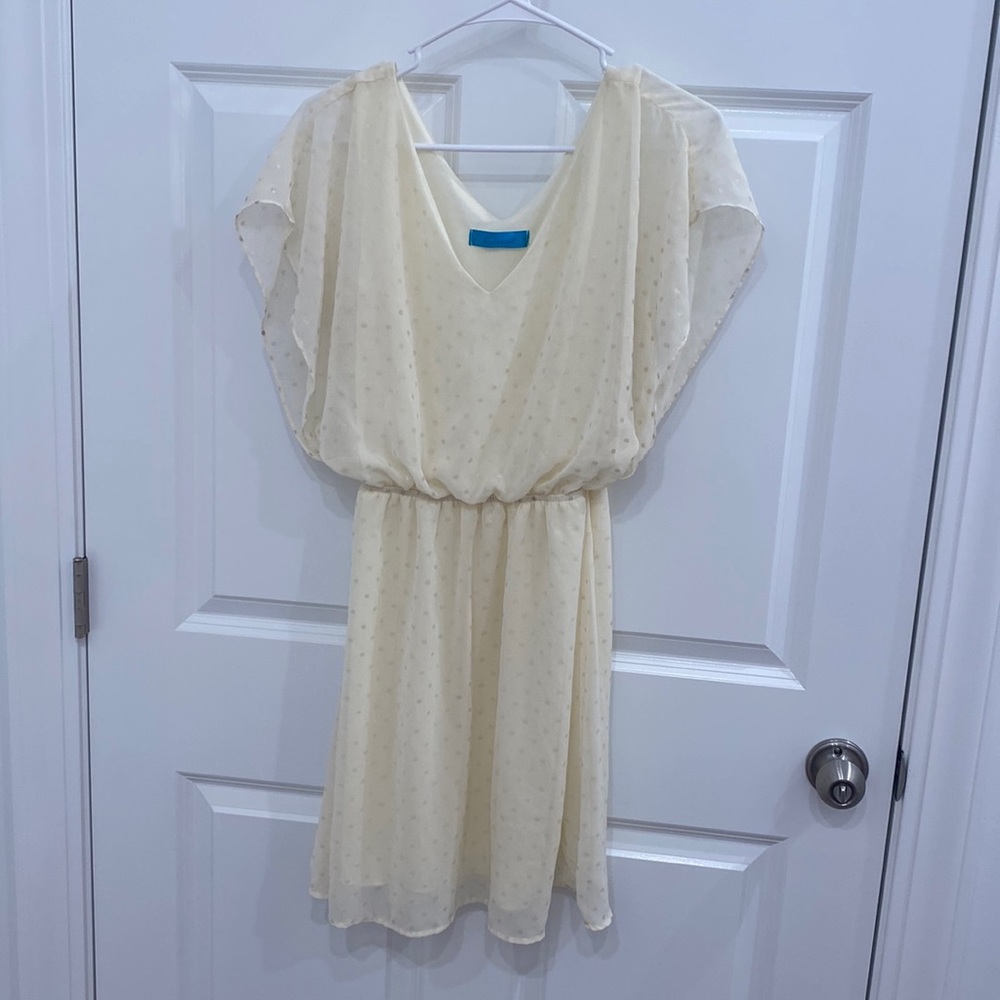 Cream flowy mini dress with shimmery gold polka dots. Size 8.
